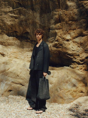 Fashion model in dark outfit